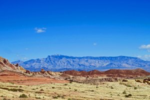 Rainbow Vista at Valley of Fire State Park in Nevada with mountains providing contrast.
