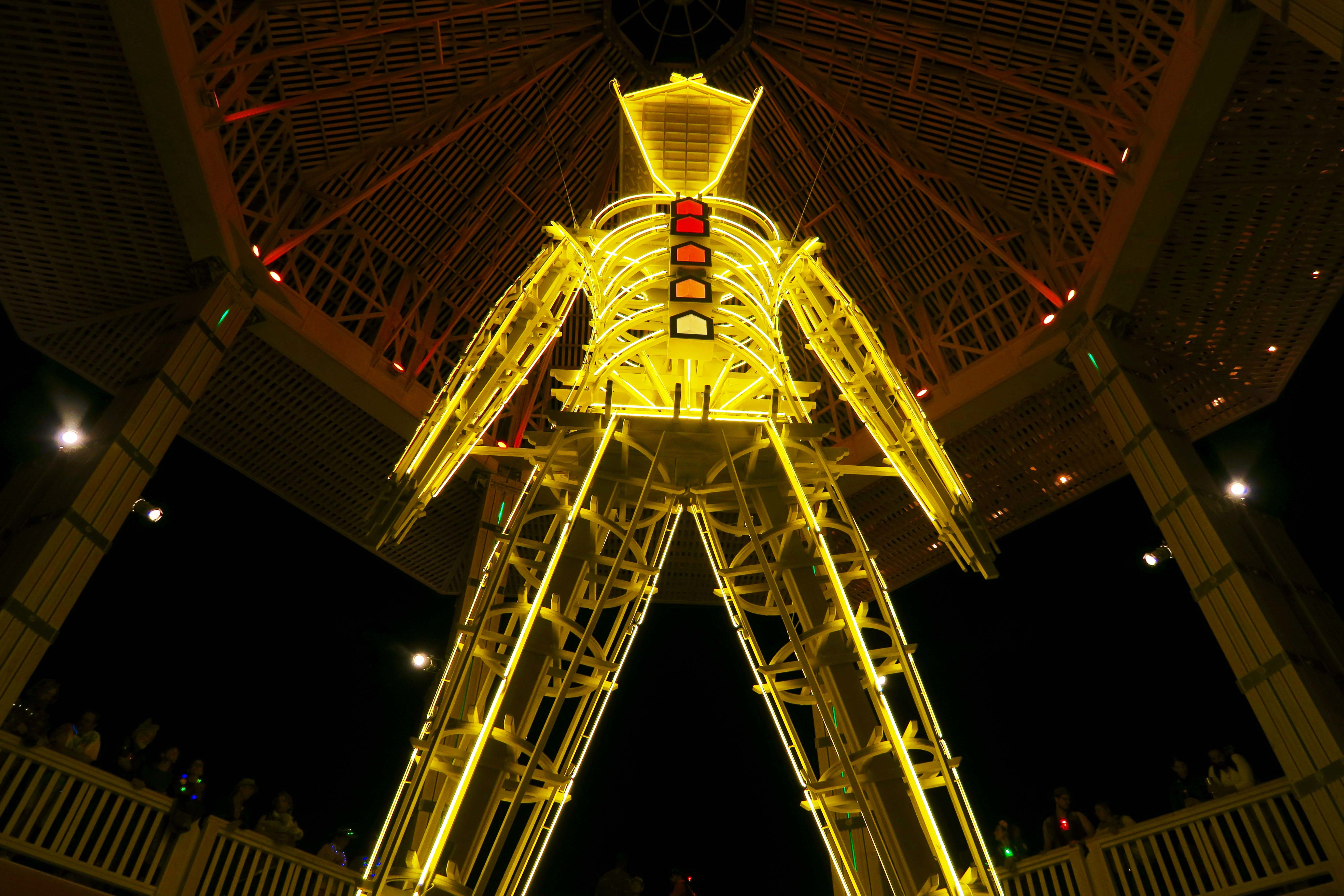 Man in Temple of Golden Spike at night, Burning Man 2 2017
