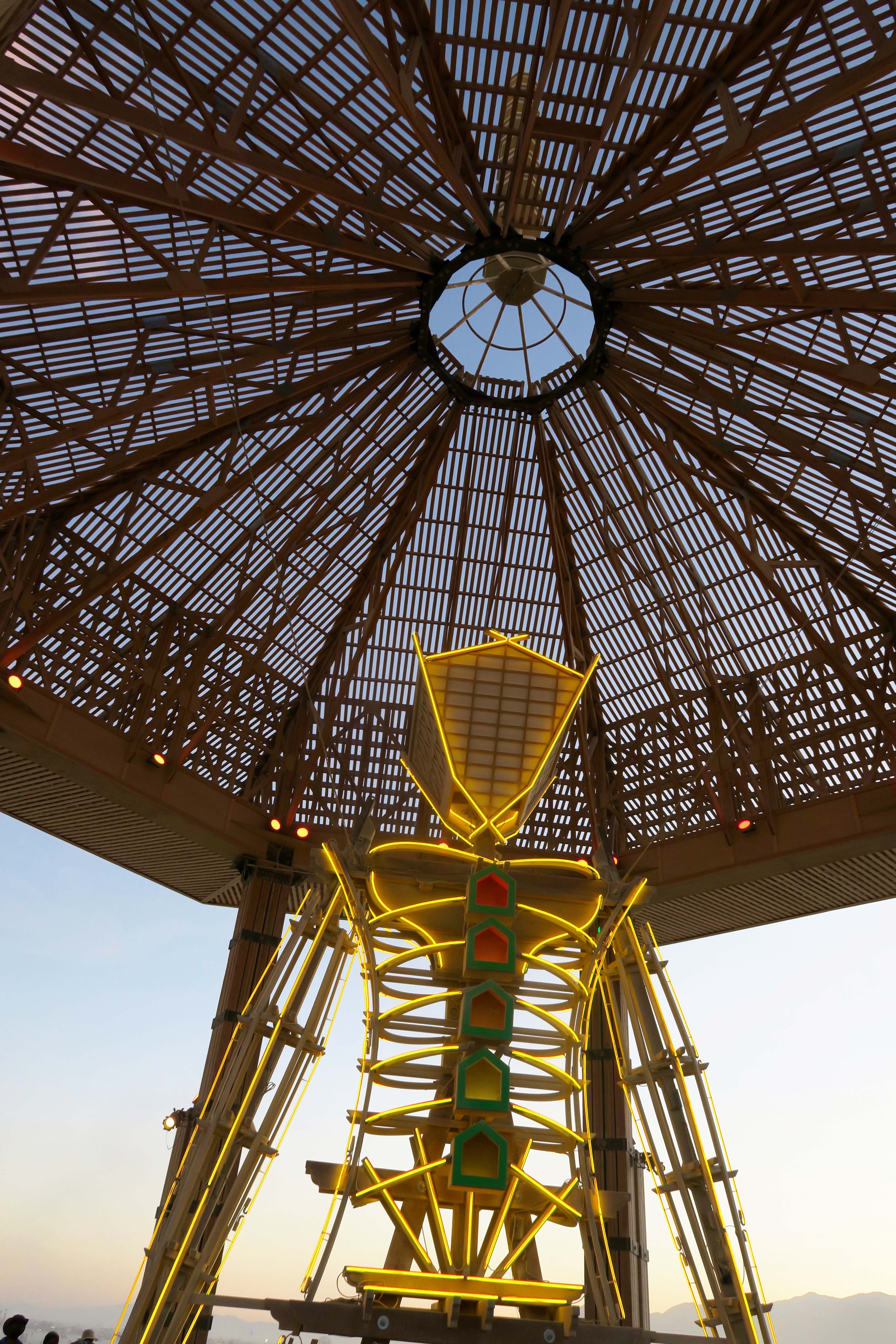 Man in Temple of Golden Spike in evening, Burning Man 2017