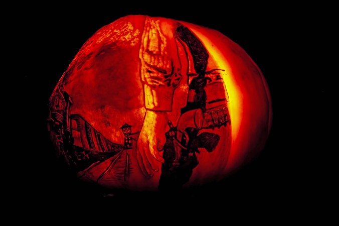 Old West gunman faces scary water tower at Jack-o-Lantern Spectacular, Providence, RI