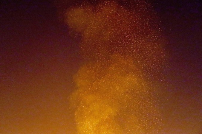 Sparks fly skyward from Temple at Burning Man 2017