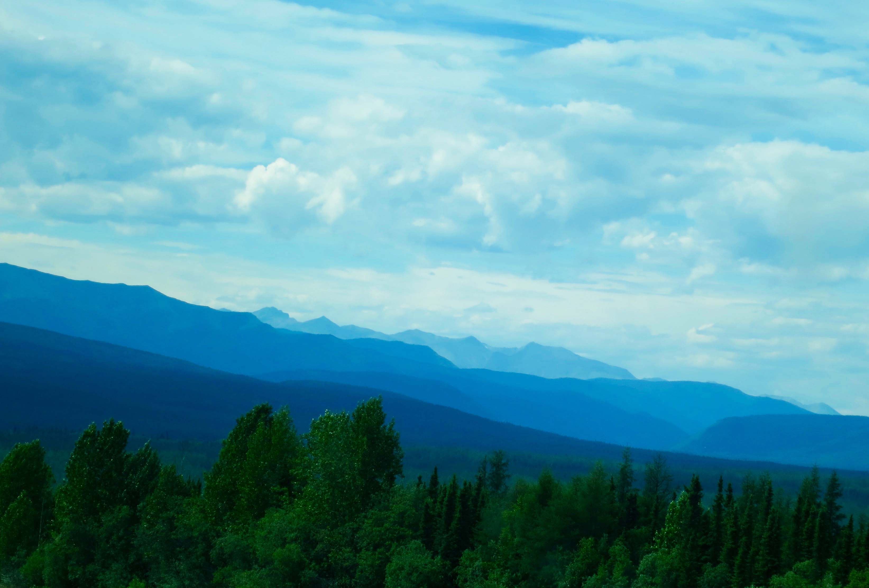 Blue mountains along the Alaska Highway in British Columbia