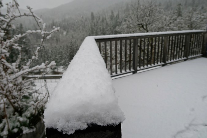 Snow gathering on railing showing perspective