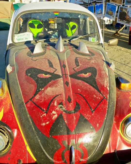 Art cat VW bug with aliens at Burning man.