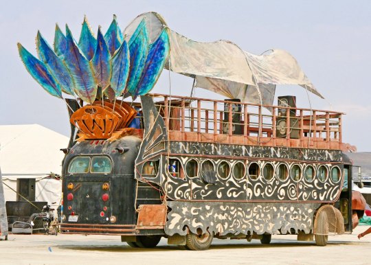 Mutant bus with tail feathers at Burning Man.