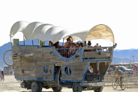 Conestoga wagon mutant vehicle at Burning Man. A side view.