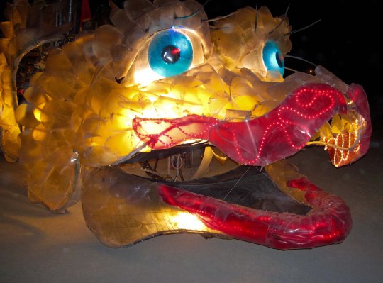 Mutant vehicle dragon at night in Burning Man.
