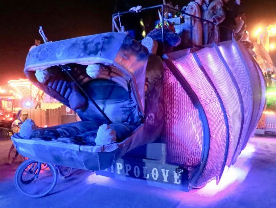 Hippo mutant vehicle at Burning Man at night.