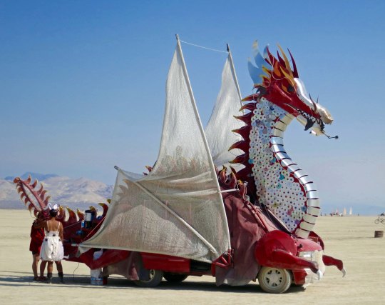 Silver and red mutant vehicle dragon at Burning Man.