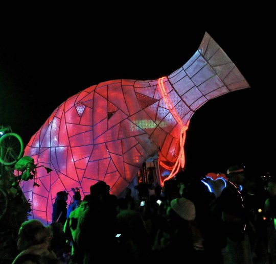 Vase mutant vehicle at Burning Man at night.