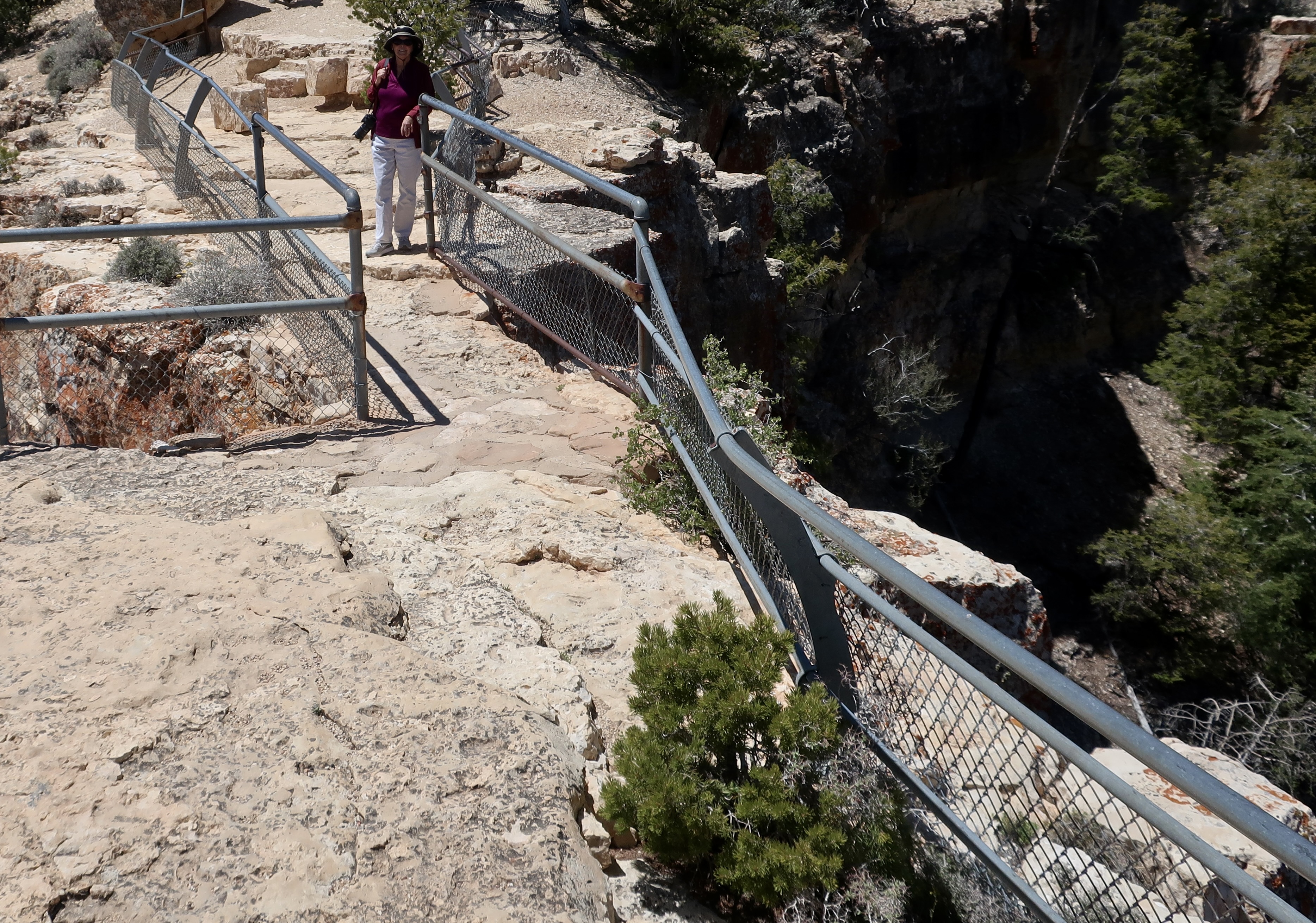 Photo of Peggy Mekemson on top of Angel's Window by Curtis Mekemson.